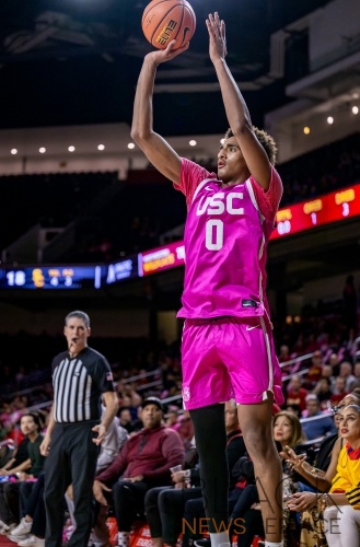 Northwestern Defeats USC 74-68